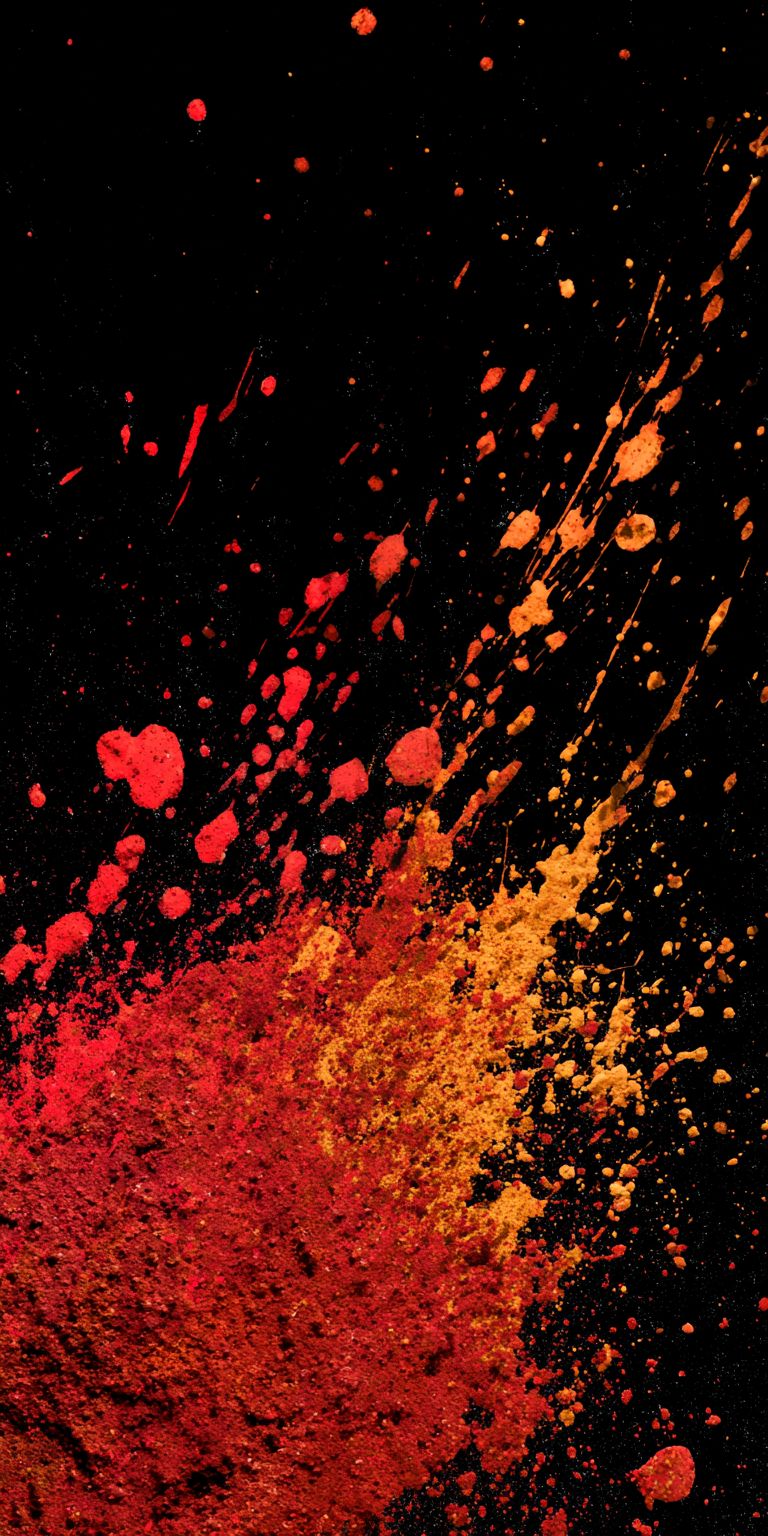 Red and brown paint splatter on a black background
