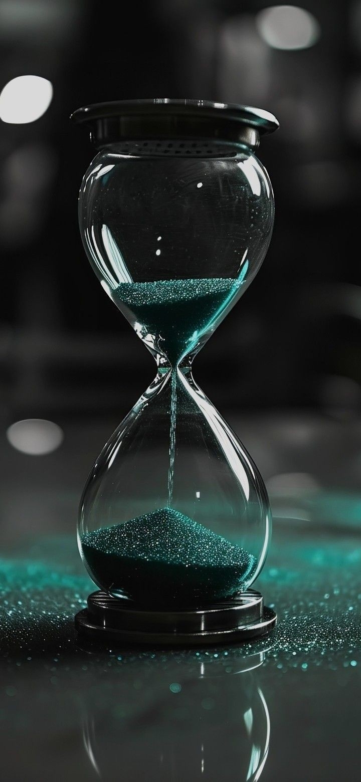 Hourglass wallpaper with flowing blue-green sand is perfect for a mysterious and cool style