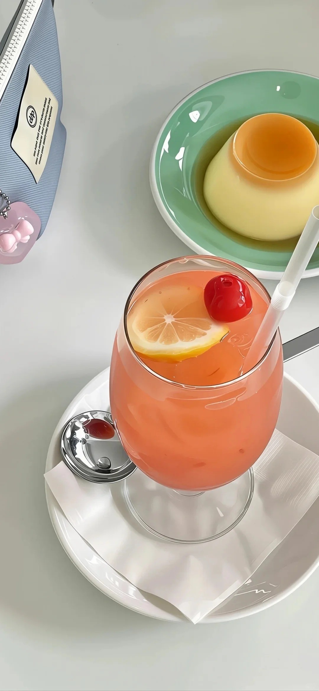 Delicate afternoon tea featuring pink orange drink and caramel pudding