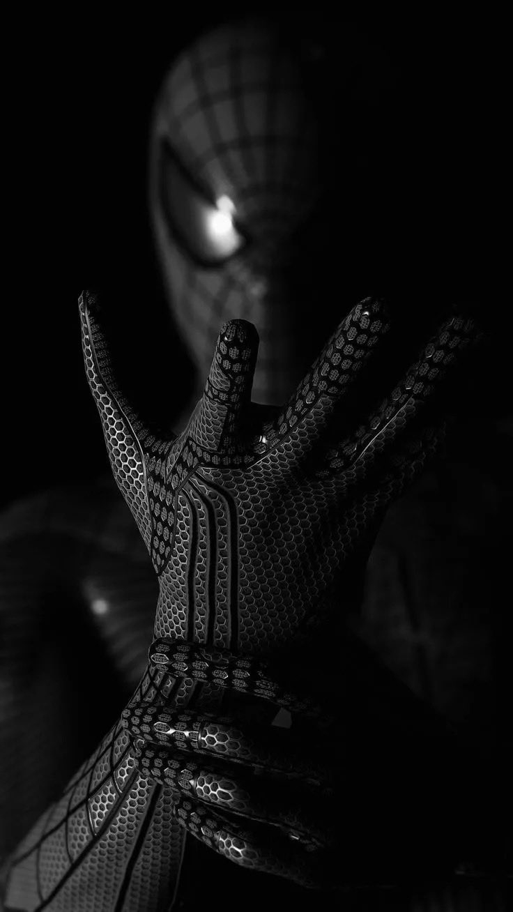This is a high-resolution wallpaper featuring a close-up of Spider-Man's hand and mask