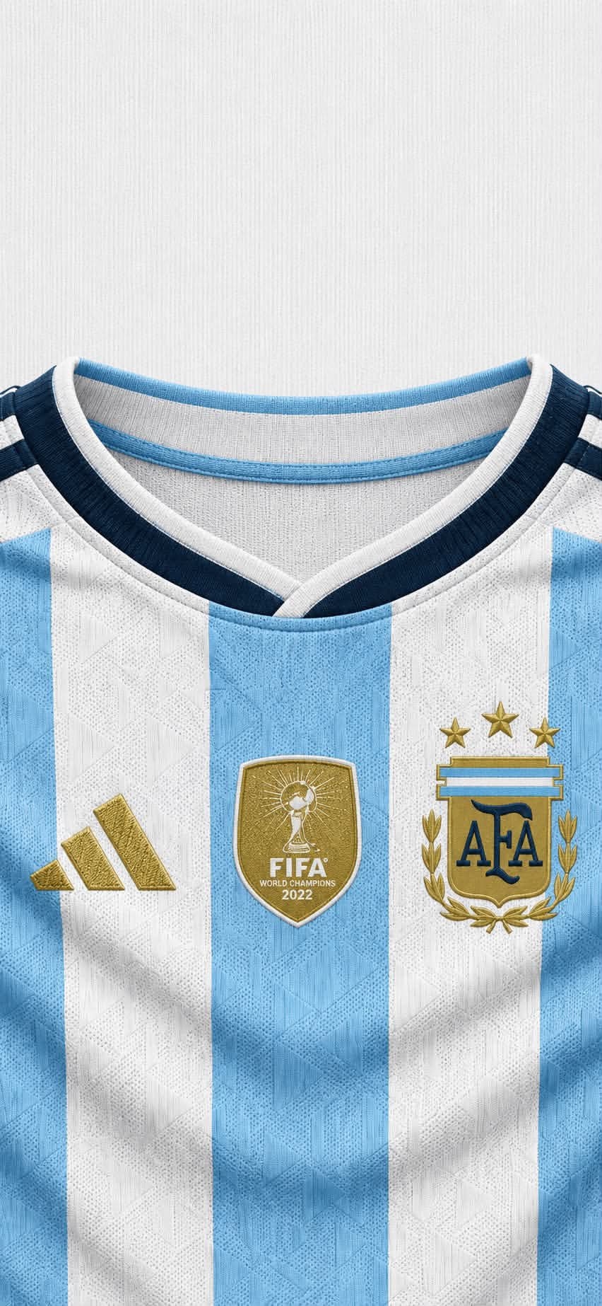 Close-up of Argentina national football team jersey with iconic light blue and white stripes and three gold emblems