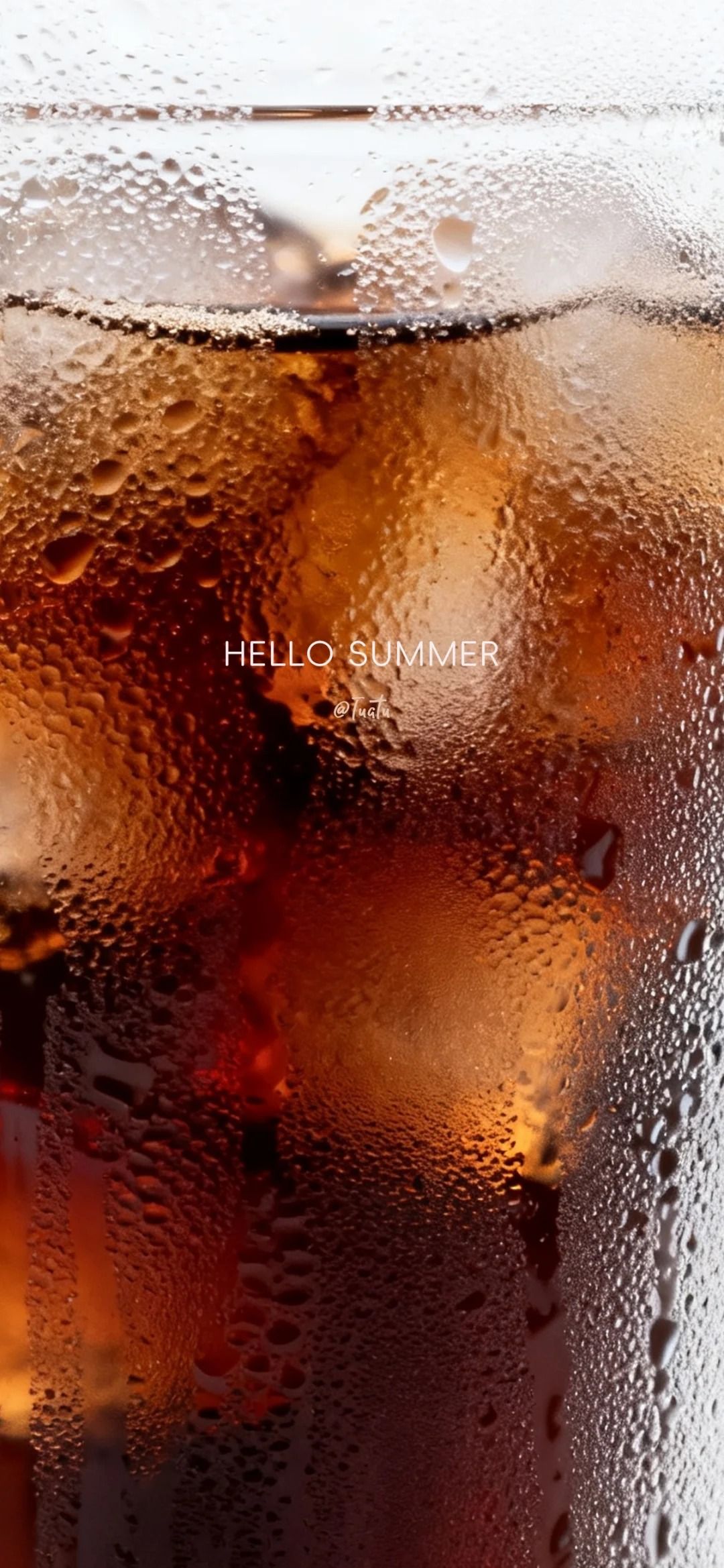 Close-up wallpaper of ice cubes floating in cola