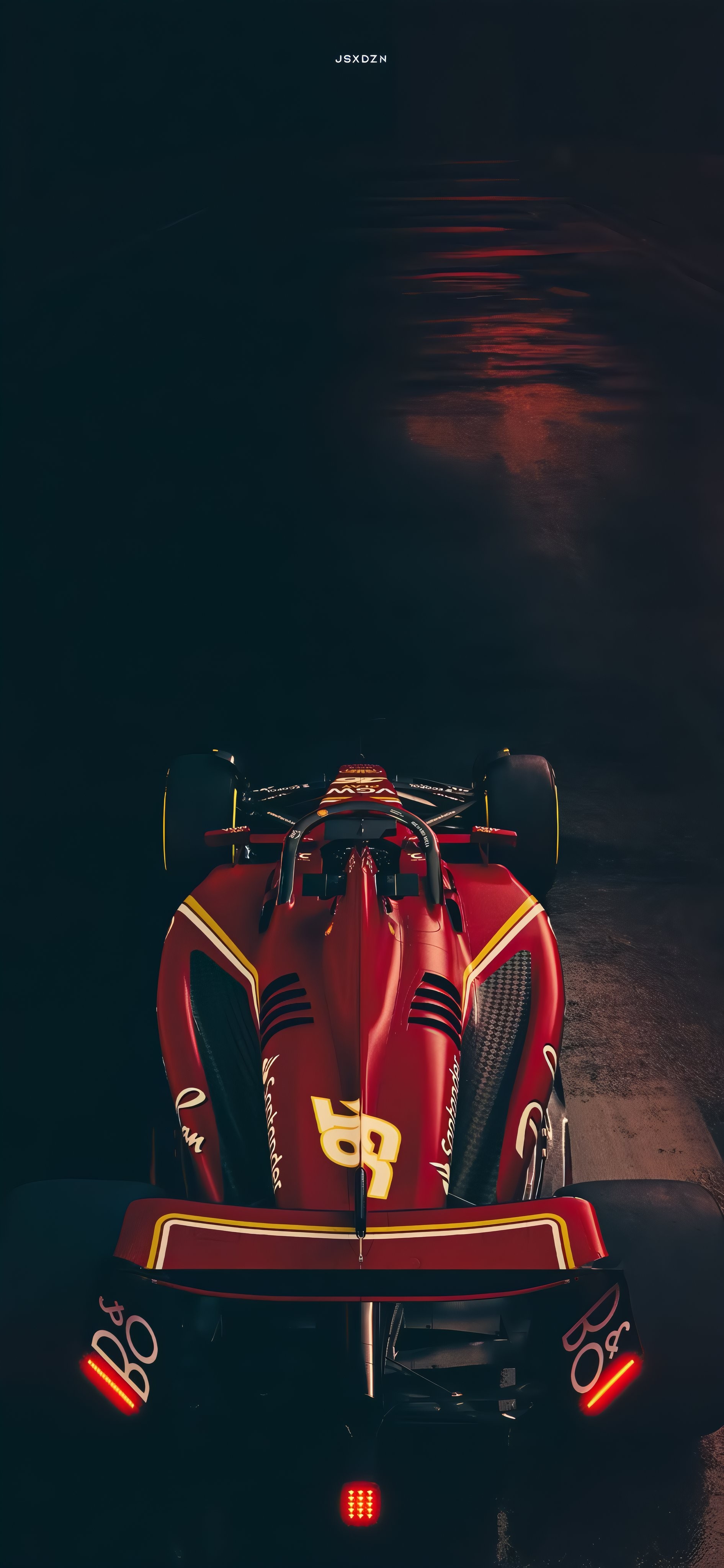 Une vue aérienne d'une Ferrari F1 mettant en valeur son design énérgique et sa beauté mécanique