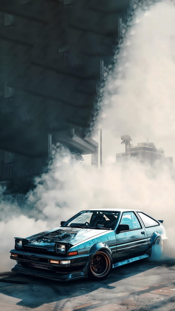 A weathered teal Toyota AE86 Trueno drifts through an industrial underpass