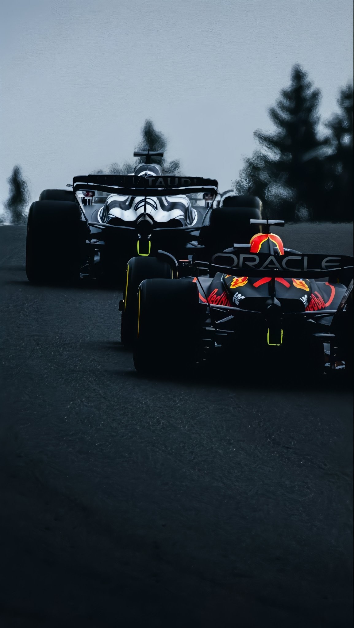 F1-Autos jagen auf einer kalten grau-blauen Rennstrecke