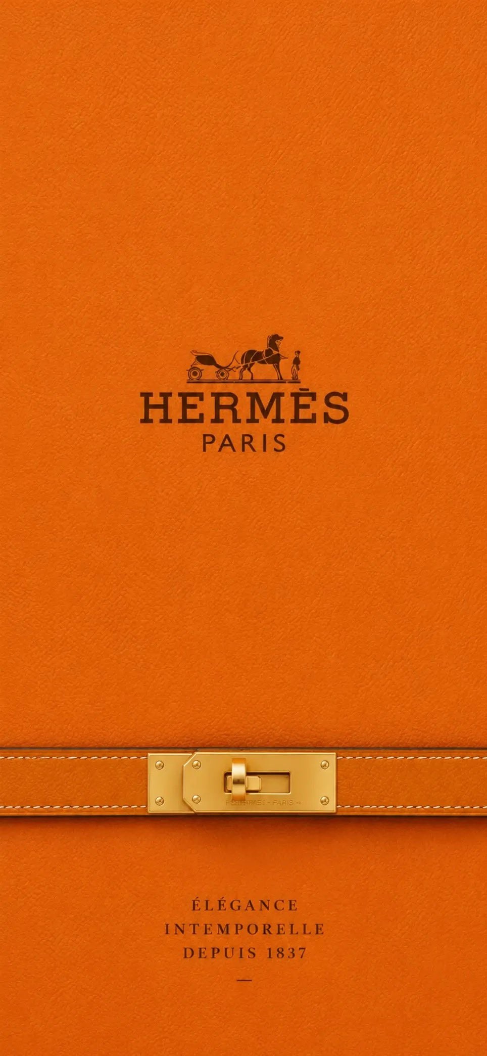 The Hermès orange bag showcases a sleek minimalist design