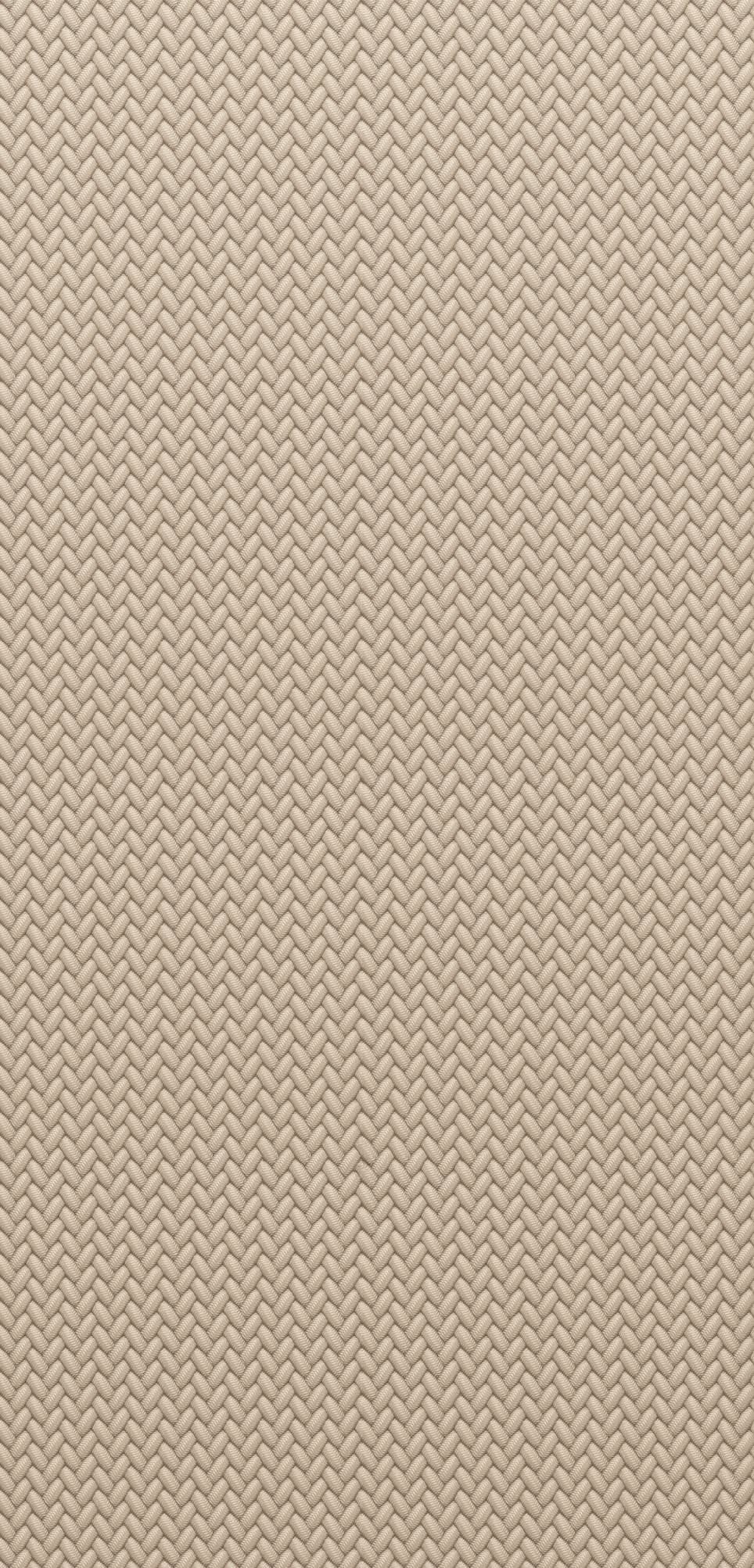 This is a close-up view of woven textile or synthetic material with a consistent herringbone pattern