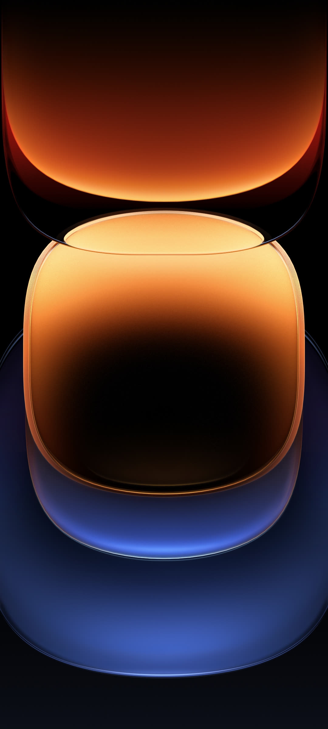 A set of glossy translucent spheres vertically stacked on a dark background with the upper sphere glowing warm amber and the lower one cool blue