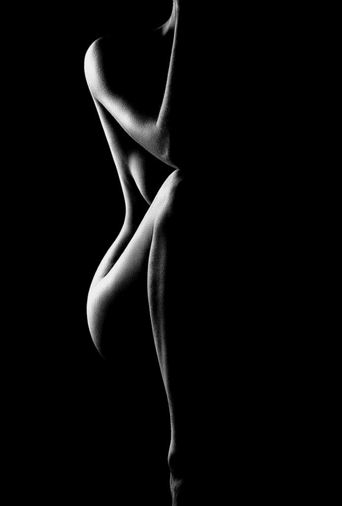 Minimalist black-and-white photography showcases the sculptural beauty of the body