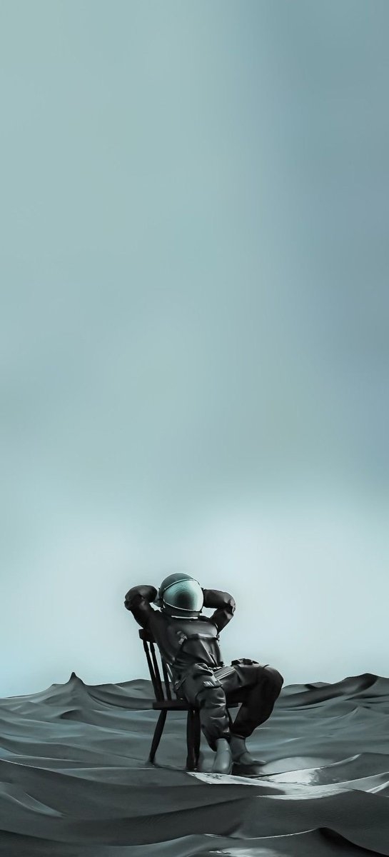 An astronaut sits quietly in a wooden chair, immersed in contemplation