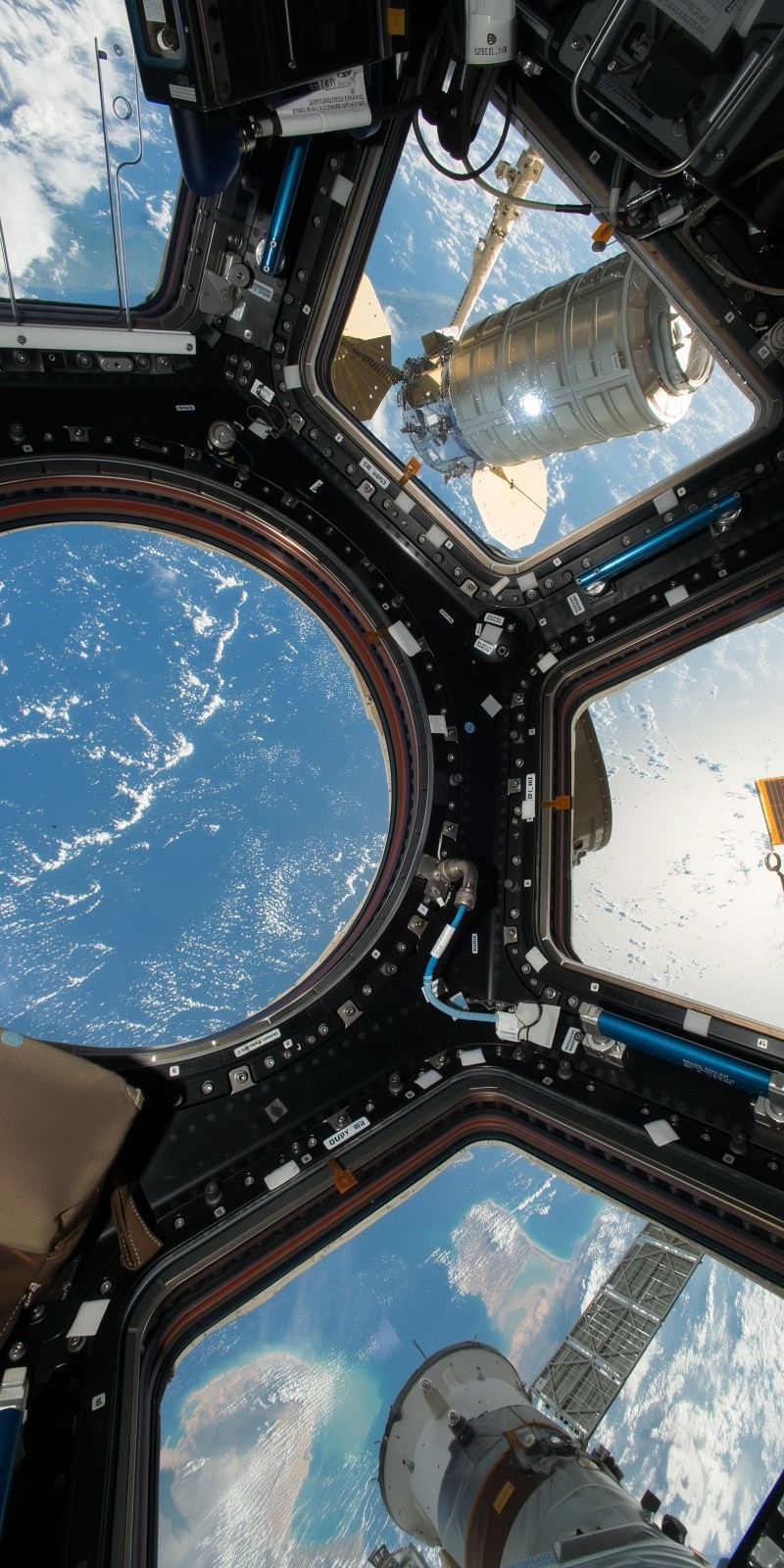 The space station's exterior showcases the beauty of Earth and space