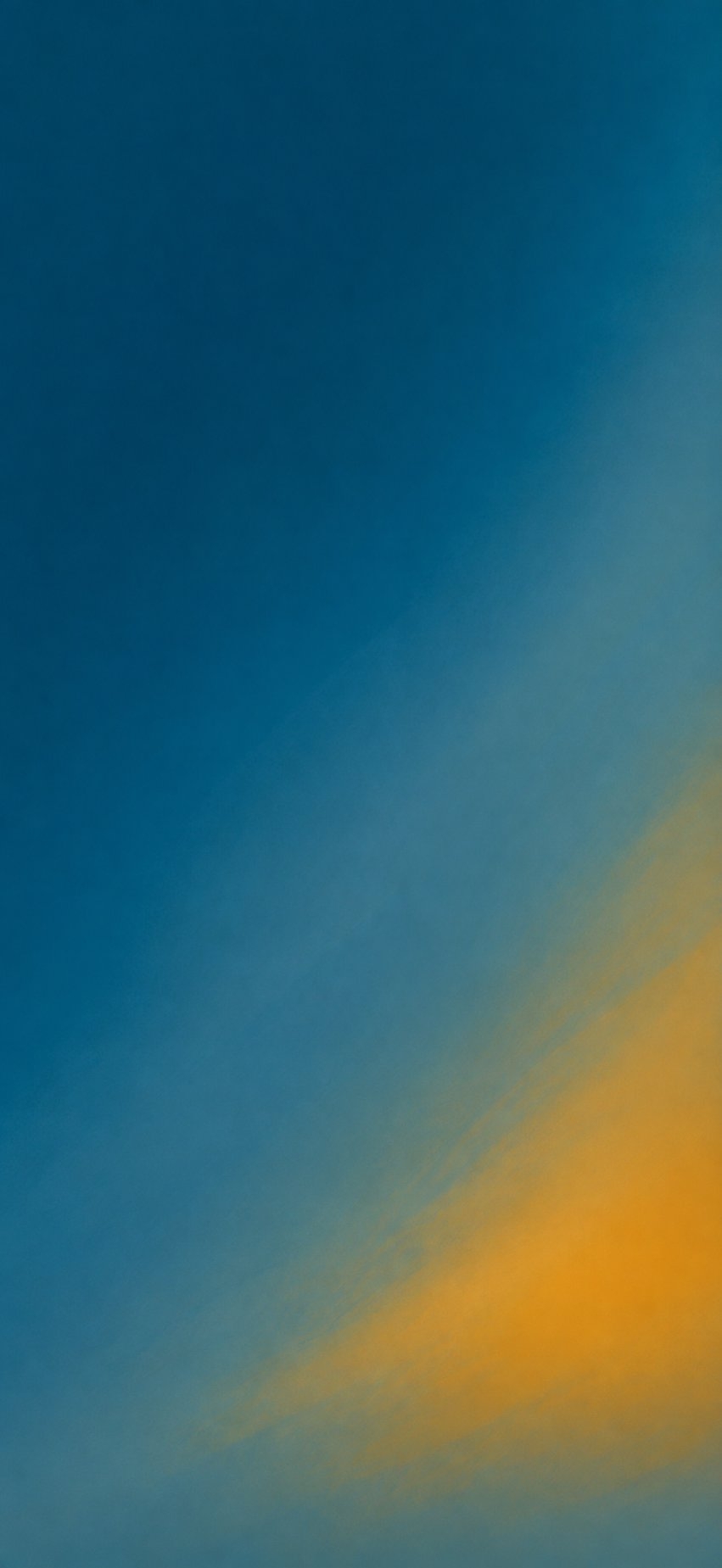 Sky gradient from deep indigo blue to luminous yellow-orange