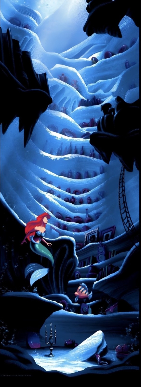 A red-haired mermaid sits in an underwater cave