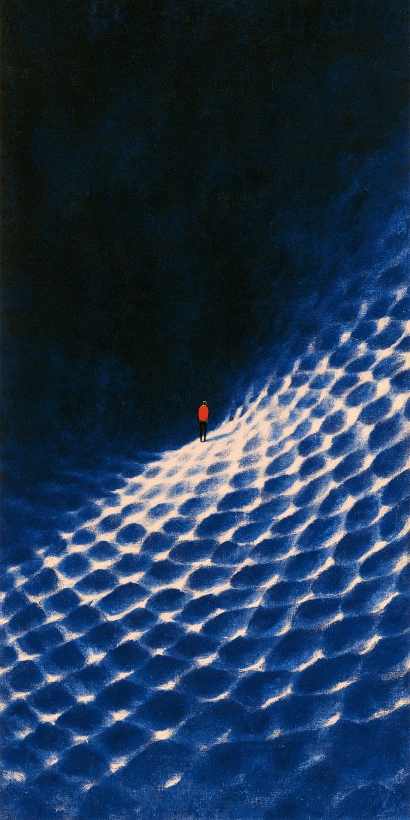 A solitary figure in a red top and black pants stands in front of a dark blue background
