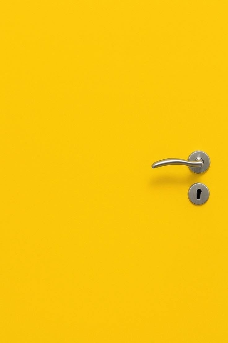 This is a pure yellow minimalist door panel with a silver handle and keyhole