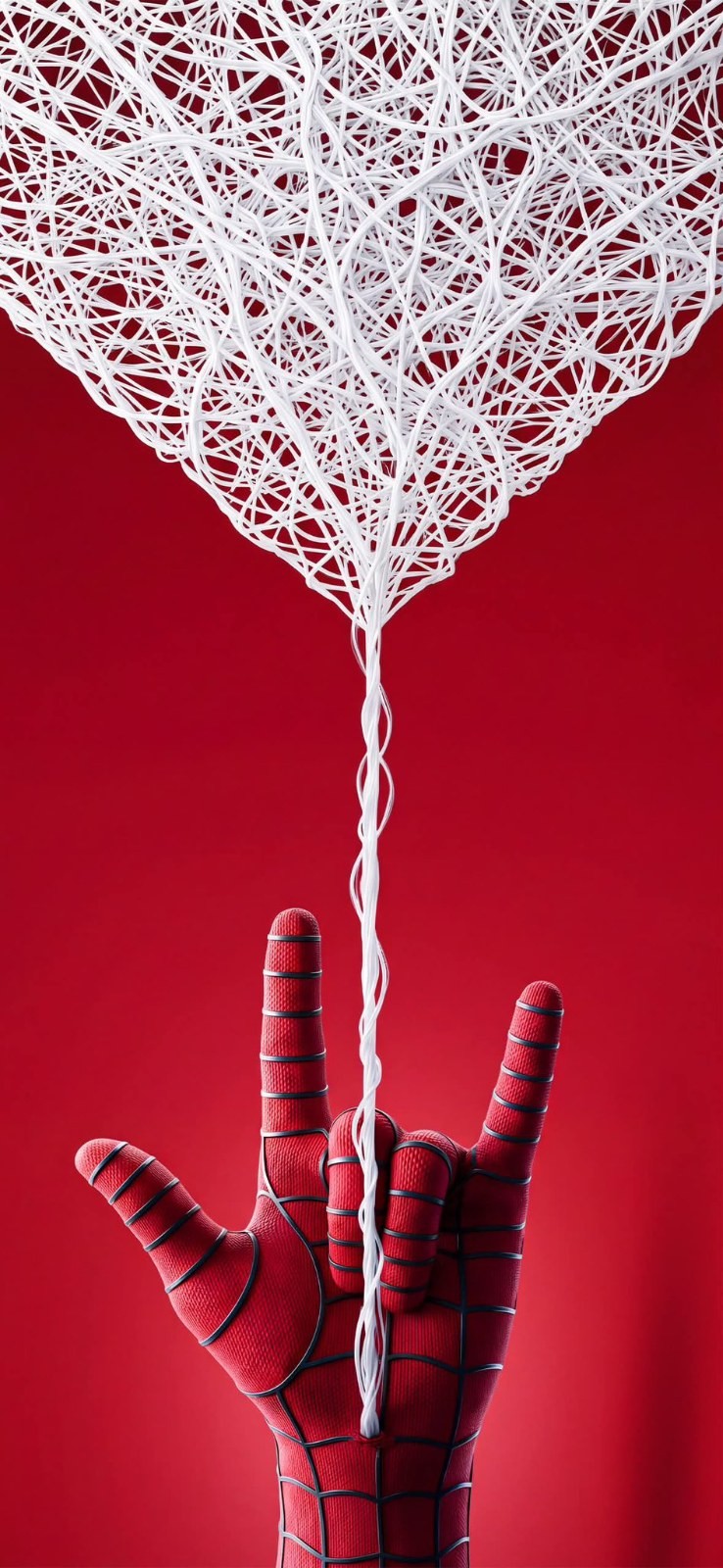 Red gloved hand shoots white threads on red background