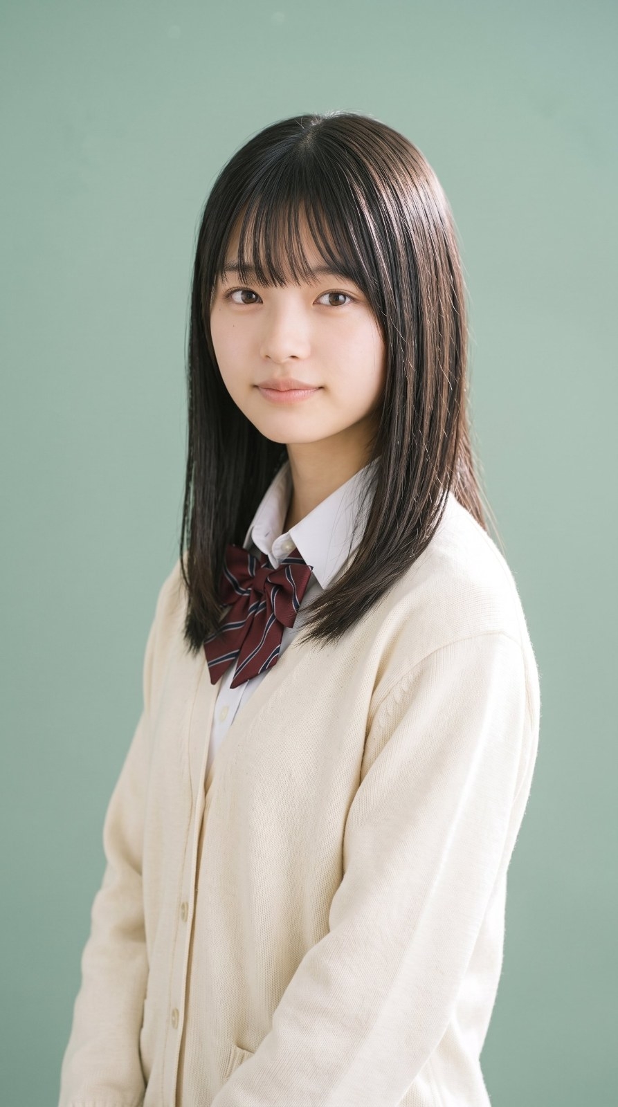 Half-body portrait of a young woman in school uniform